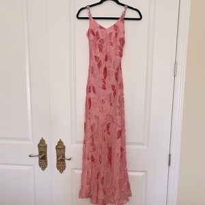 Pink leaf gown with velvet detail and rhinestone shoulder straps.